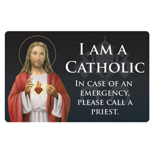 A Sacred Heart Catholic ID card featuring an image of Jesus Christ in a white robe, holding a red heart, with text that reads 'I am a Catholic. In case of an emergency, please call a Priest.