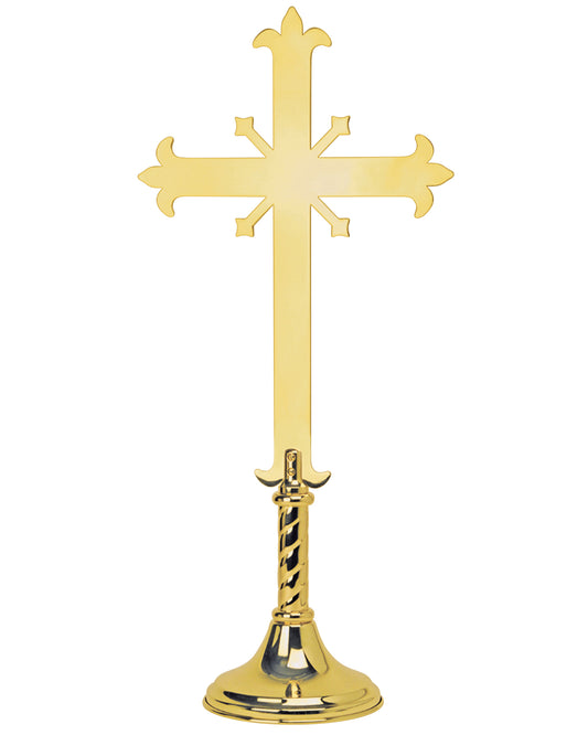 Gold cross with a detailed base on a white background