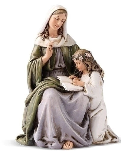 Statue of a woman and a child sitting together on a white background