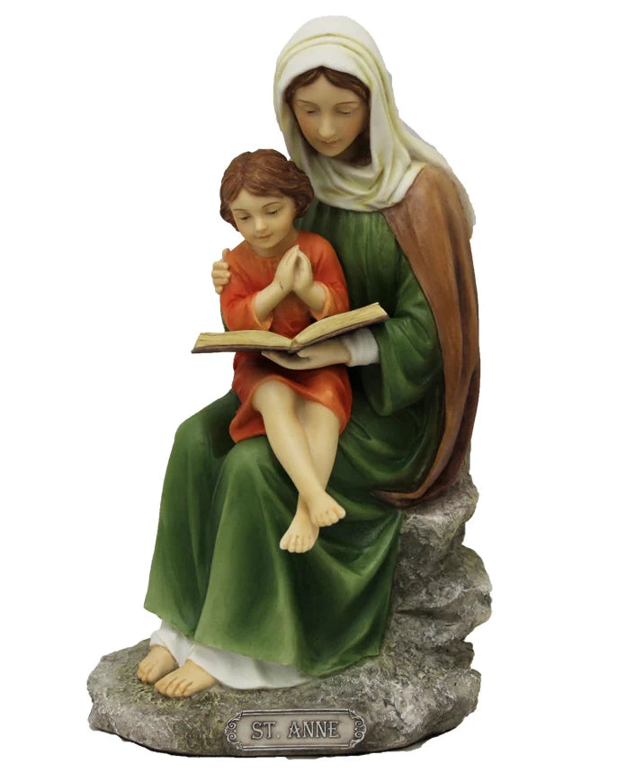 Statue of a woman reading a book to a child on a white background