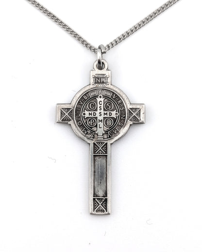 Silver cross pendant necklace on a white background