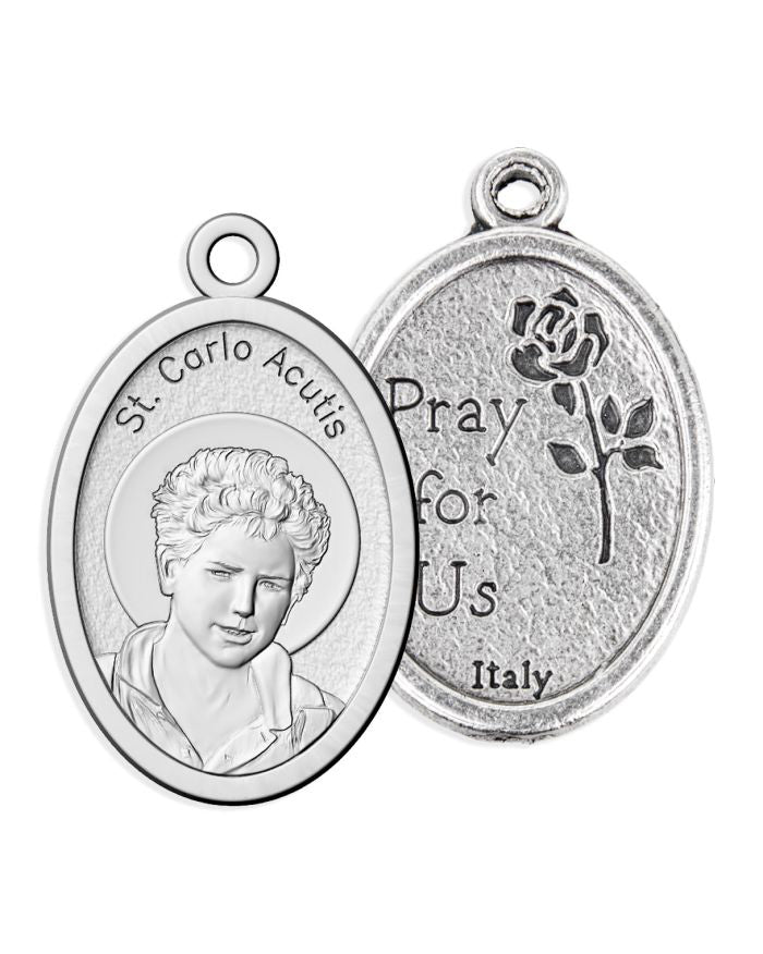 Silver religious pendant with a portrait and text on a white background