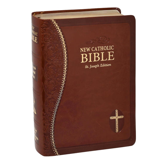 Brown leather-bound New Catholic Bible with gold cross on a white background