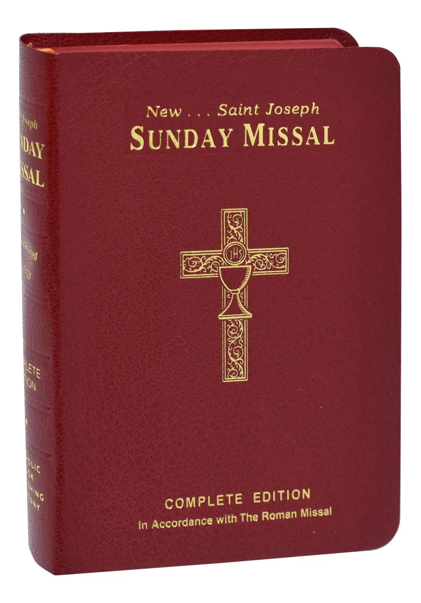 Red book titled 'Saint Joseph Sunday Missal' with a gold cross on a white background