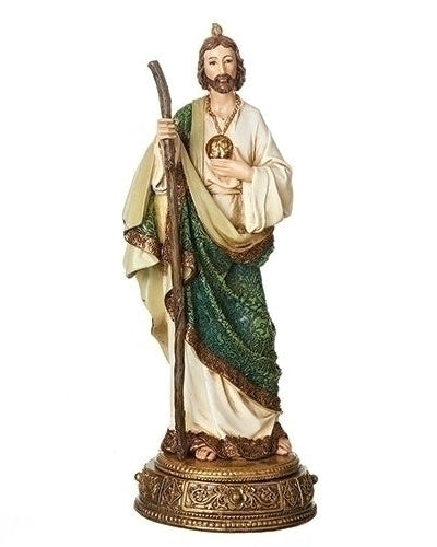 Statue of a religious figure holding a staff on a white background