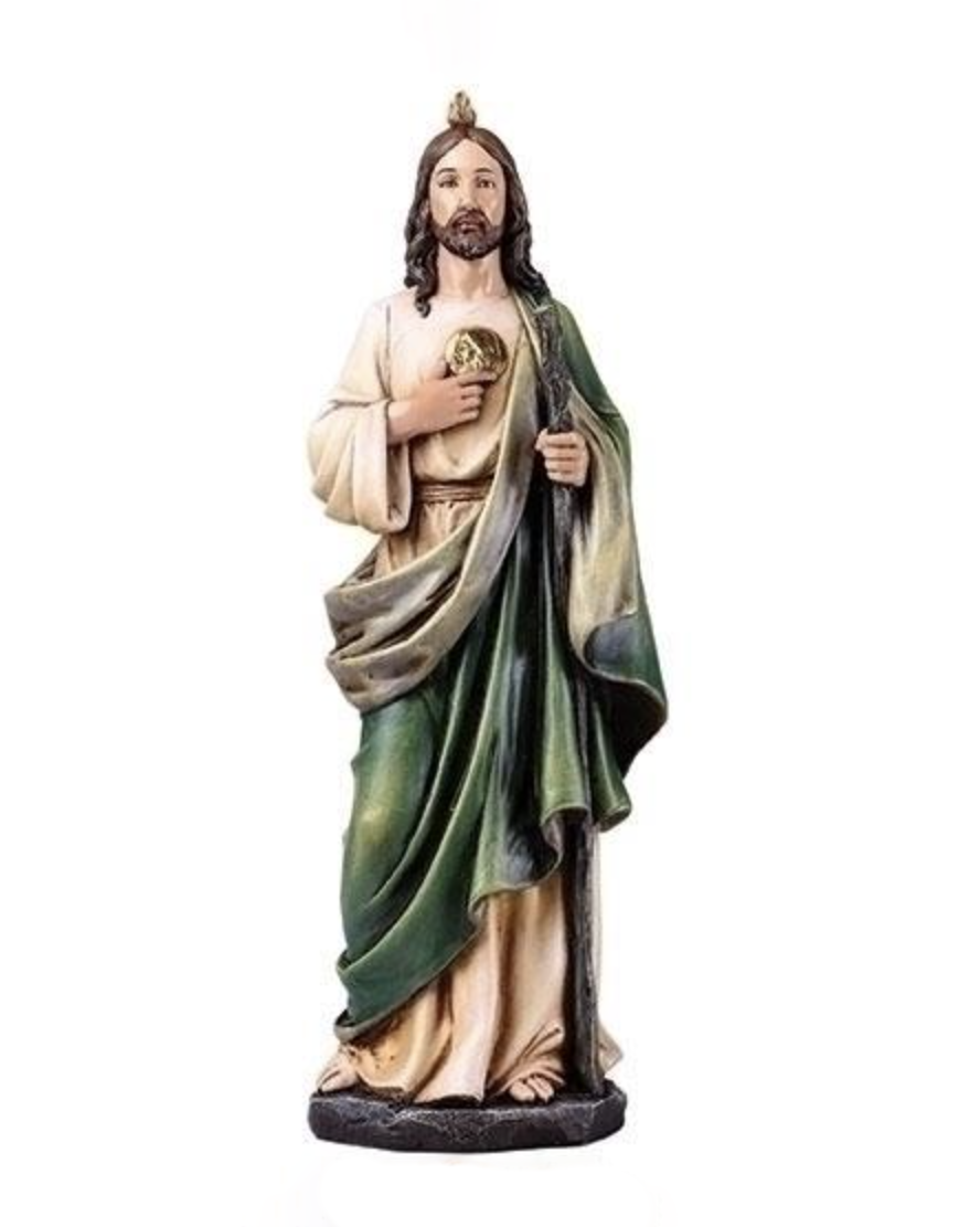 Statue of a religious figure with green robe and white garment on a white background