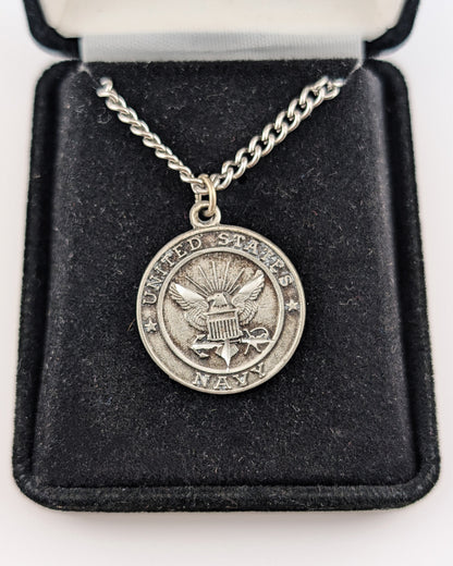 Silver necklace with a U.S. Army pendant on a black velvet display box.