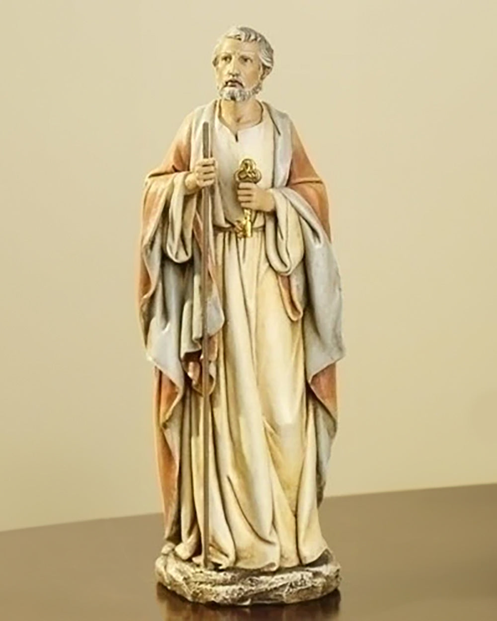 A statue of St. Peter made of resin stone mix, featuring the figure in a standing pose with attributes such as a key and a book, wearing apostolic attire.