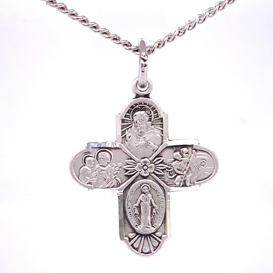 Silver cross pendant with religious figures on a white background