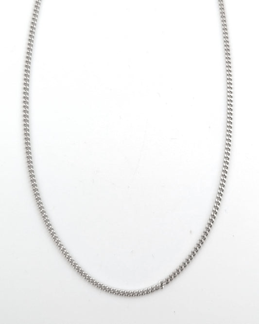 Silver chain necklace on a white background