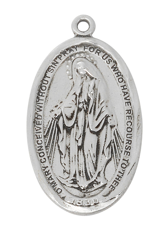Silver medal with religious design on a white background