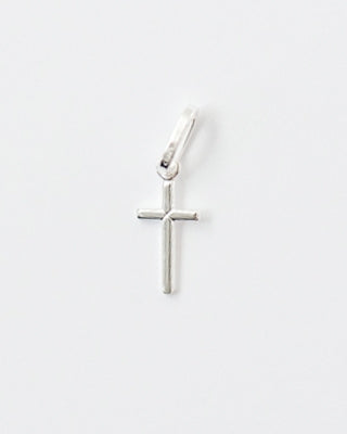 Silver cross pendant on a white background