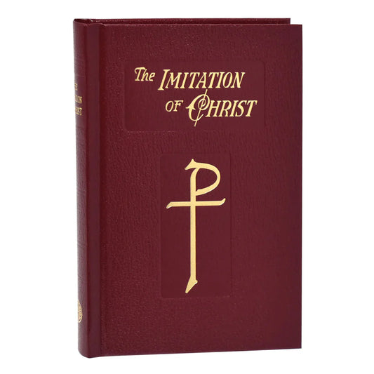 Maroon book titled 'The Imitation of Christ' with gold lettering and cross symbol on a white background