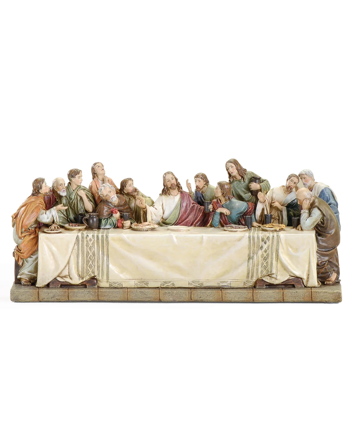 Statue of 'The Last Supper' with figures around a table on a white background