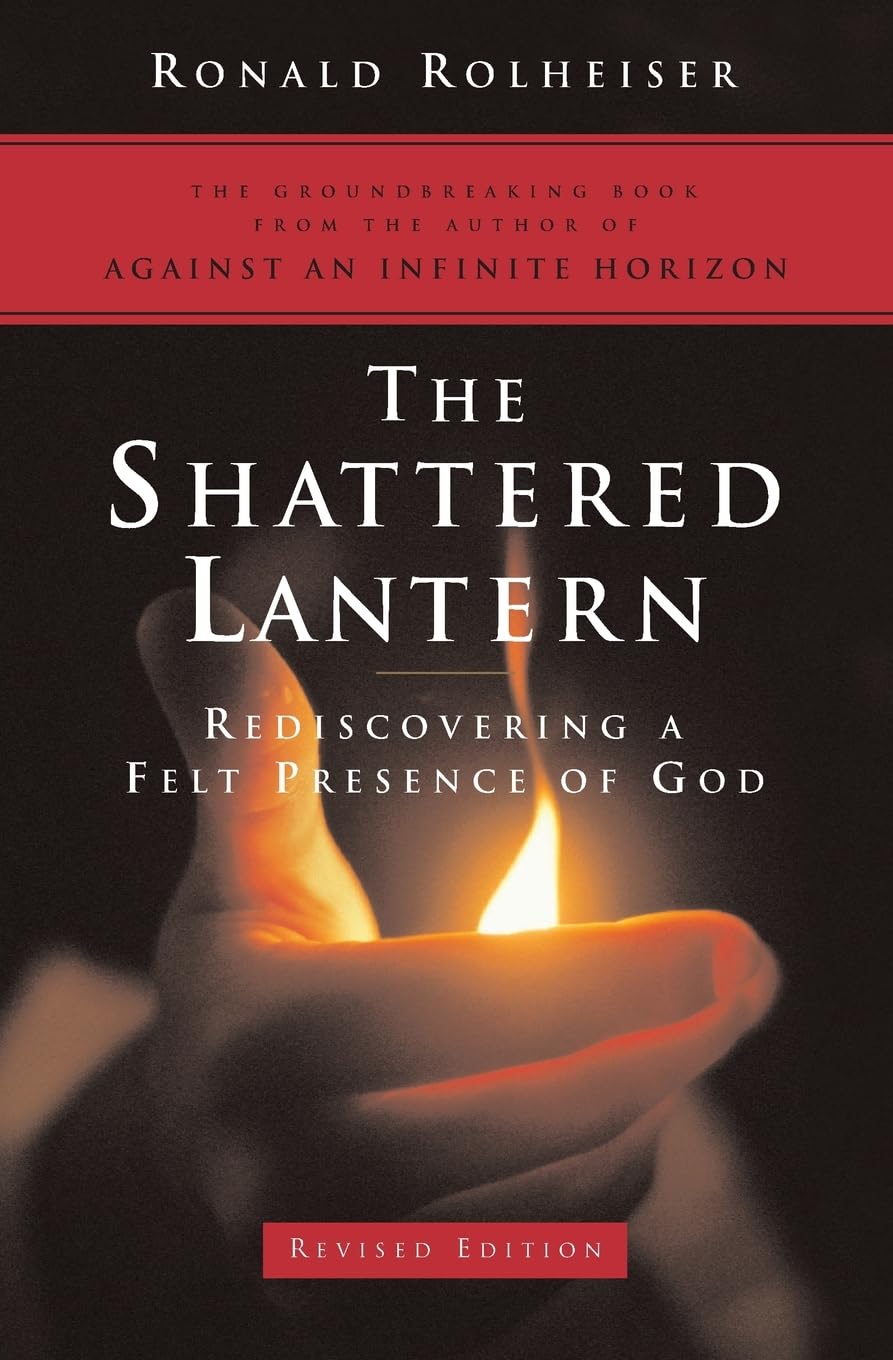 Book cover of 'The Shattered Lantern' with a hand holding a lit candle against a dark background.