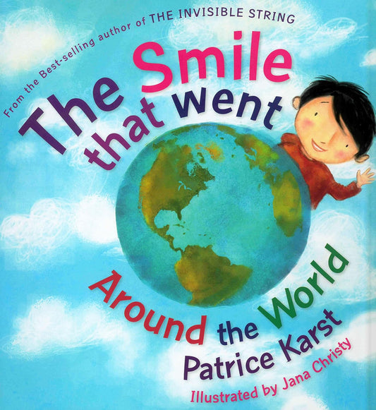 Book cover of 'The Smile that Went Around the World' with a child holding the Earth.