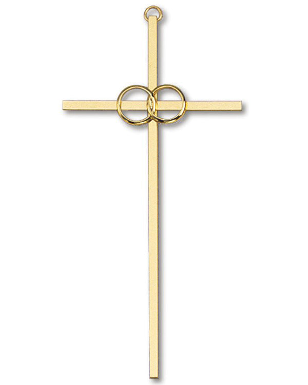 Gold cross pendant with circular design on a white background