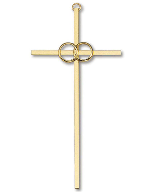 Gold cross pendant with circular design on a white background