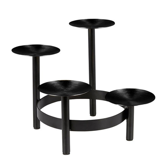 Black metal plant stand with multiple levels on a white background