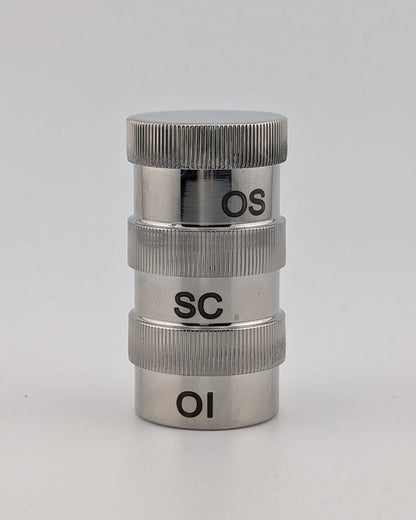Metallic cylindrical object with 'OS', 'SC', and 'OI' markings on a white background
