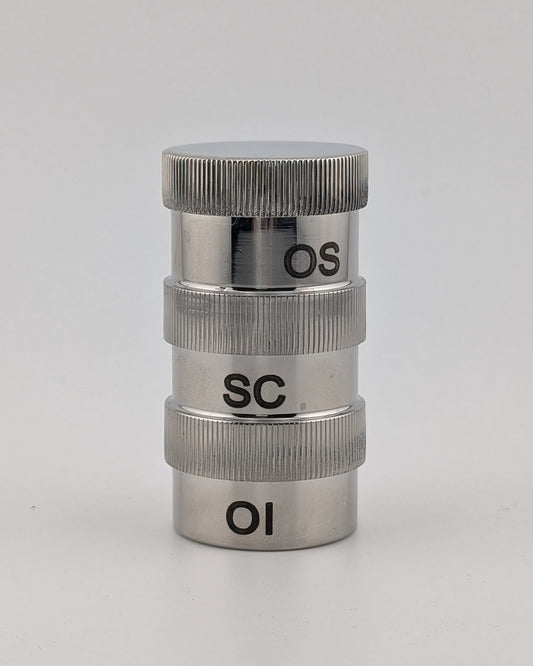 Metallic cylindrical object with 'OS', 'SC', and 'OI' markings on a white background