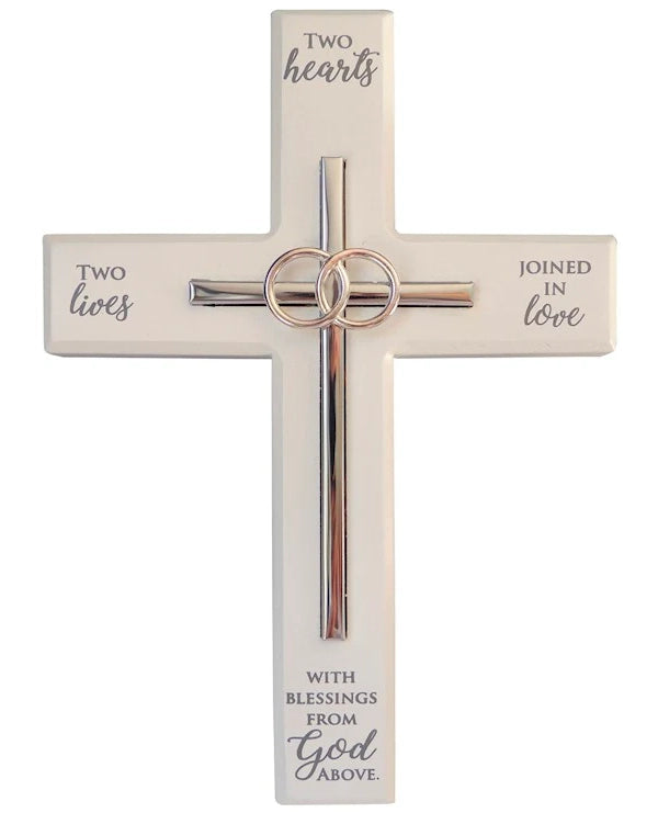 Decorative cross with rings and text on a white background