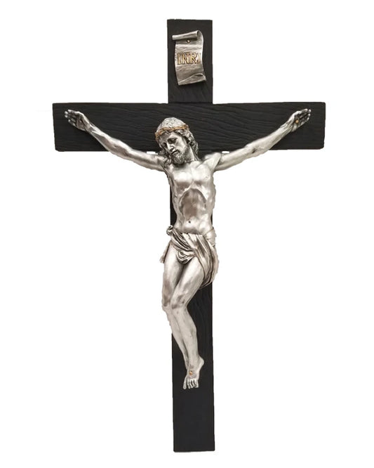 Black crucifix with silver Jesus figure on a white background