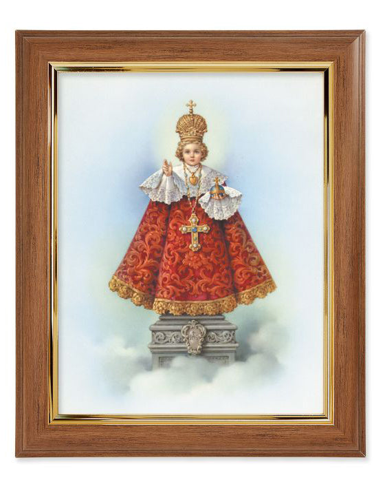 Framed artwork of a religious figure in a red robe with gold accents on a white background