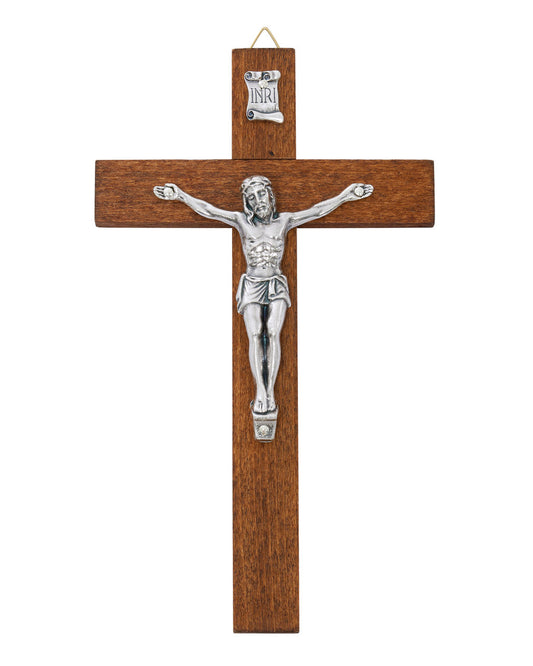 Wooden cross with silver Jesus figure on a white background