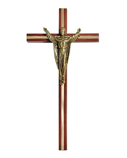 Wooden cross with a gold-colored Jesus figure on a white background