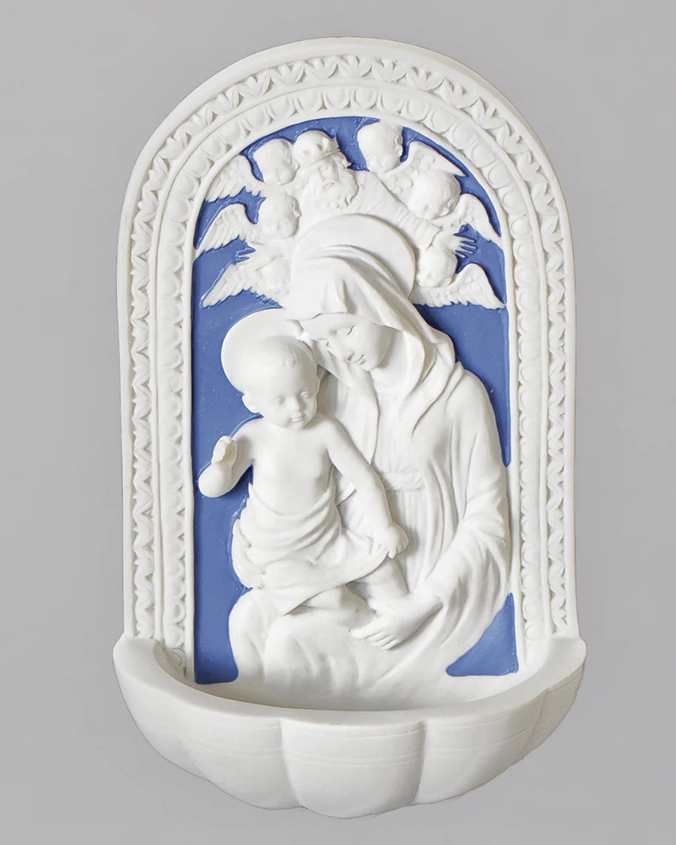 Decorative wall piece with white relief sculpture on a grey background
