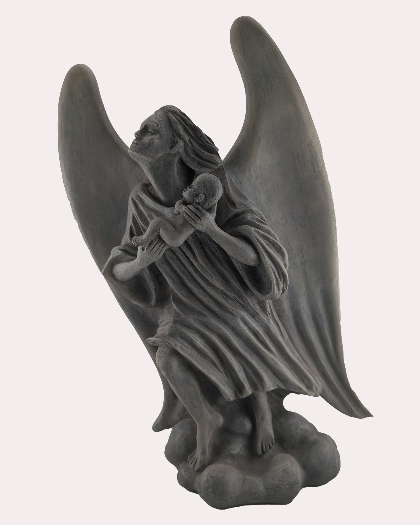 Statue of an angel holding a baby on a white background