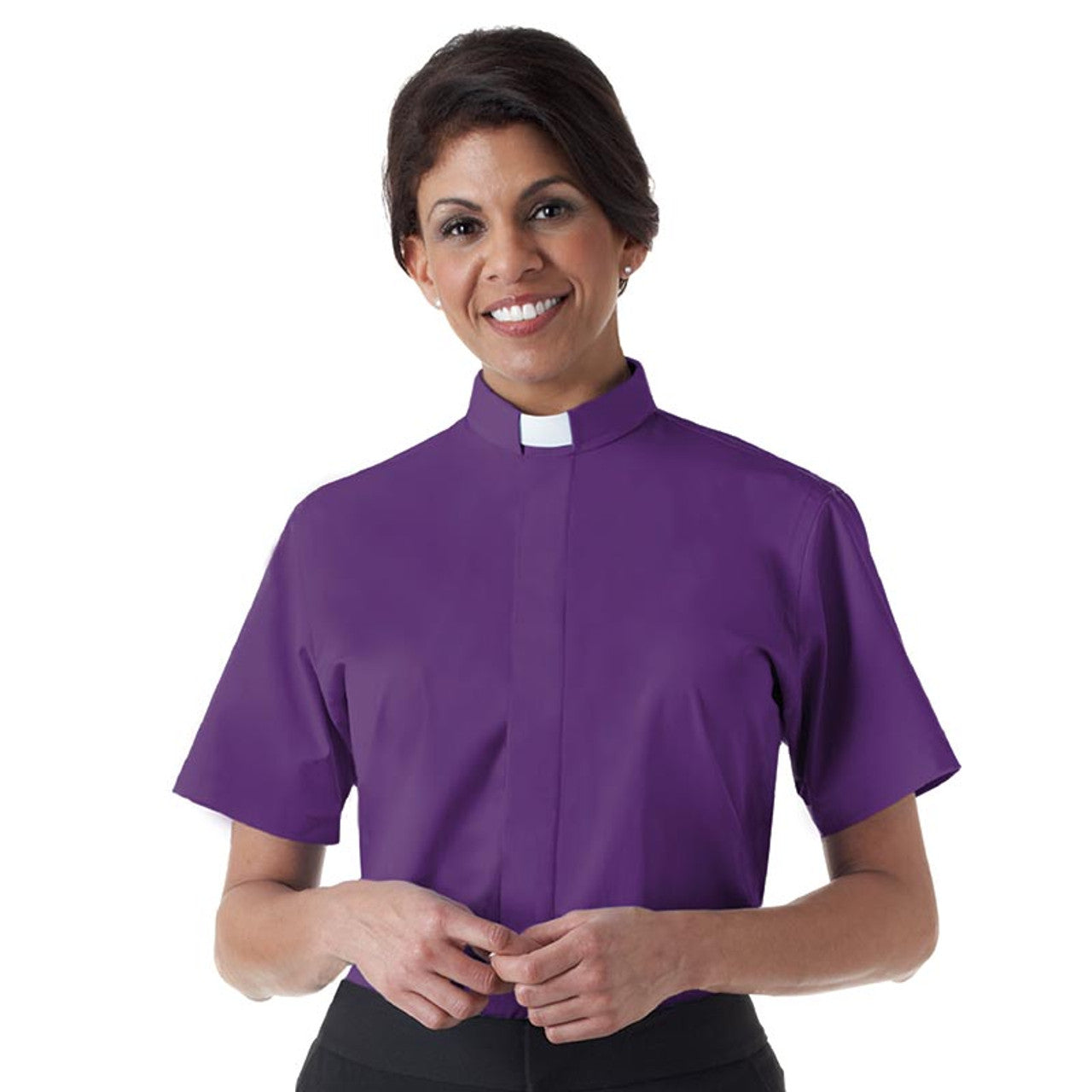 A woman wearing a purple short-sleeve tab collar clergy shirt.