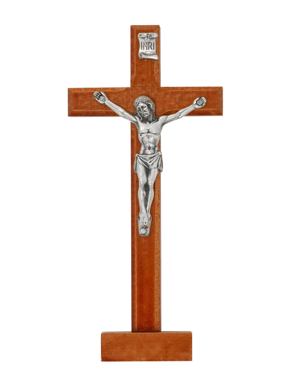 Wooden crucifix with silver Jesus figure on a white background