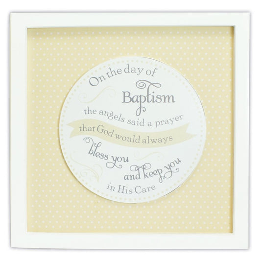 A wooden plaque with a polka dot border, featuring text that reads 'On the day of Baptism the Angels said a Prayer' followed by a blessing and a quote.