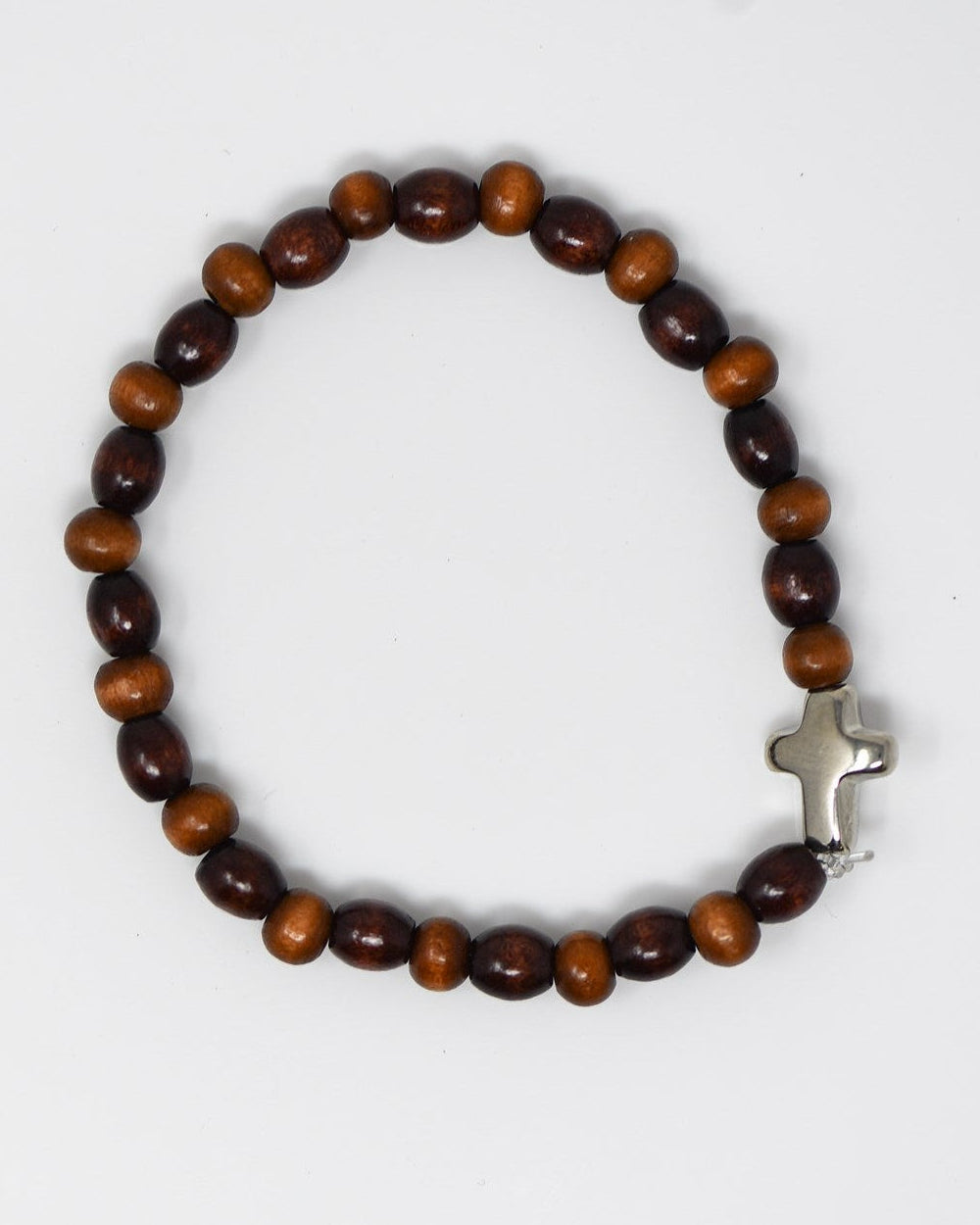 Wooden beaded bracelet with a silver cross on a white background