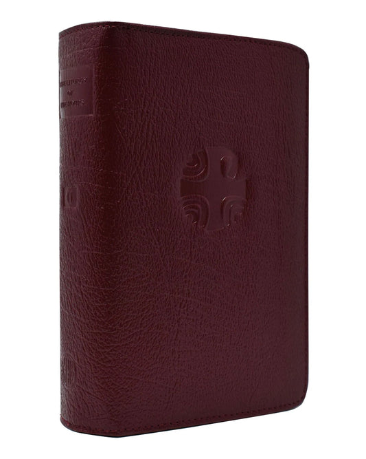 Maroon leather-bound book with a embossed design on a white background