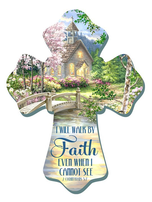 Decorative cross with a scenic village and floral elements, featuring a motivational quote.