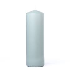 A single tall, cylindrical pillar candle in a pale sage green color, photographed against a plain white background.