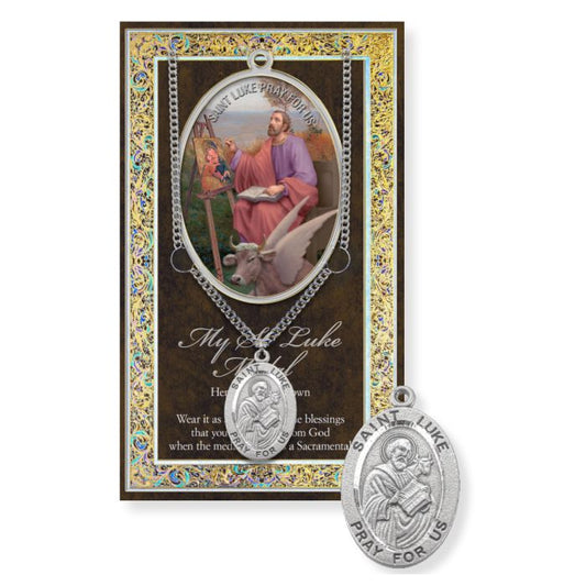 St. Luke the Evangelist pendant with prayer card on a white background