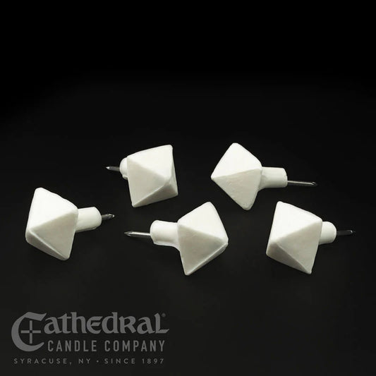 Five white candle wick trimmers on a black background with Cathedral Candle Company branding.