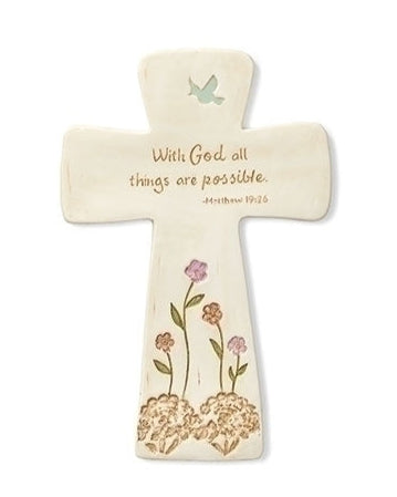 A beige porcelain wall cross with a Bible verse 'With God all things are possible' written on it, along with decorative floral designs and a small butterfly illustration.