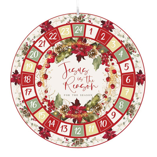A round advent calendar with numbers 1 to 24, decorated with red and green flowers and the text 'Jesus is the Reason'.