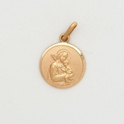 A small round 10K yellow gold medal featuring an image of Saint Joseph holding the baby Jesus.