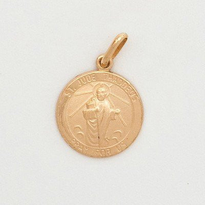 A gold round medal with an image of a saint, attached to a gold chain.