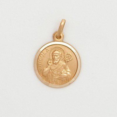 A small round 10KT gold medal featuring an image of St. Nicholas, without a chain, presented against a white background.