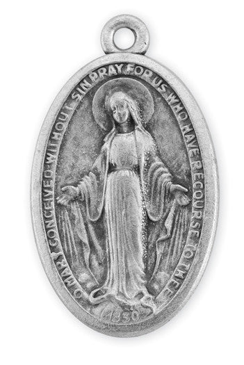 Antique silver plated miraculous medal featuring an image of the Virgin Mary standing, holding a book, with rays of light emanating from her, on a looped chain.