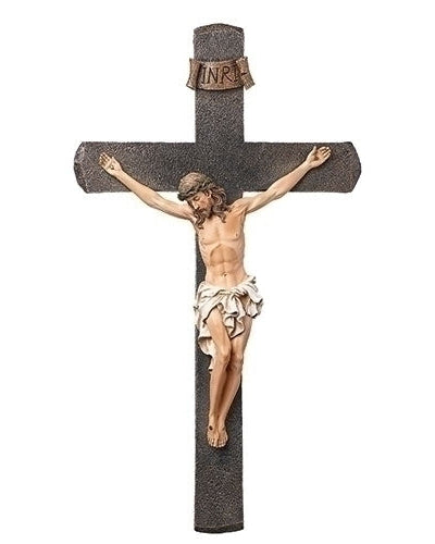 Statue of Jesus on a cross with 'INRI' inscription on a white background