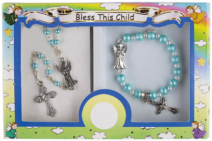 A boxed set containing a rosary and a bracelet with a metal cross and guardian angel centerpiece, displayed on a colorful background with illustrations of angels.