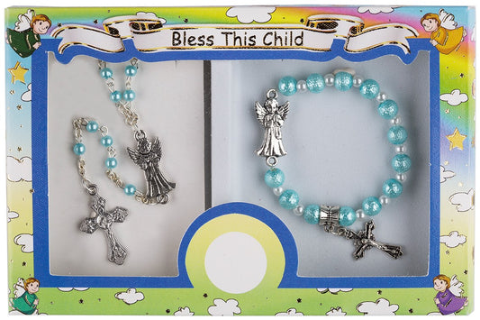 A boxed set containing a rosary and a bracelet with a metal cross and guardian angel centerpiece, displayed on a colorful background with illustrations of angels.